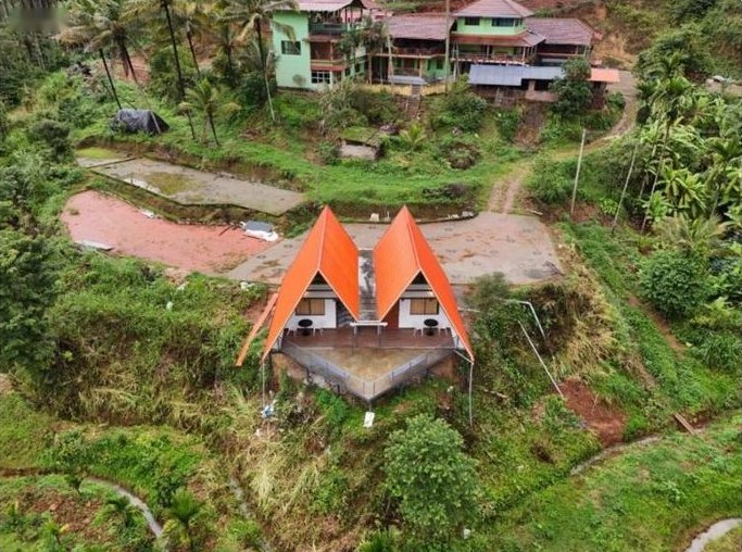Aerial view of the property and surrounding land