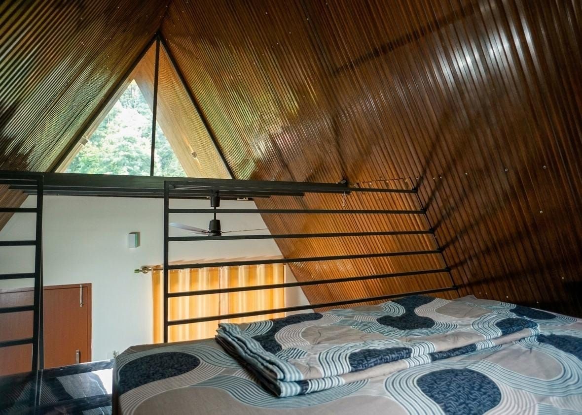 Loft bedroom under the A-frame ceiling